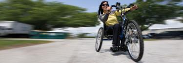 inspirational|TE EX.jpg|Sport wheelchair Top End Excelerator woman driving on street