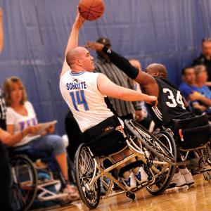 benefit|BB.jpg|Sport wheelchair Top End Schulte 7000 man playing basketball