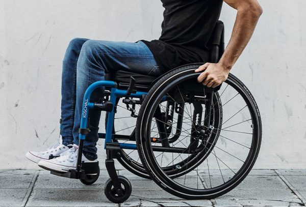 Why are wheelchair footrests essential for posture?