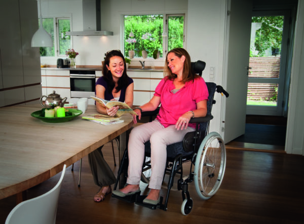 Can a reclining wheelchair assist with postural management?