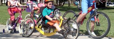 inspirational|Product 2005 032.jpg|Sport wheelchair Top End XLT Junior yellow frame boy on the street