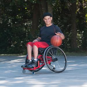 benefit|Pro 2_BE02.jpg|Sport wheelchair Top End Pro 2 man playing basketball